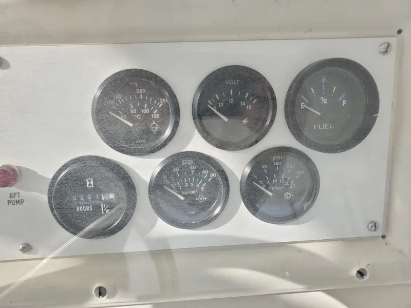 Slide: The Image of Dashboard gauges of a 1988 Post 46 Sportfish boat, showing various engine metrics. - 22