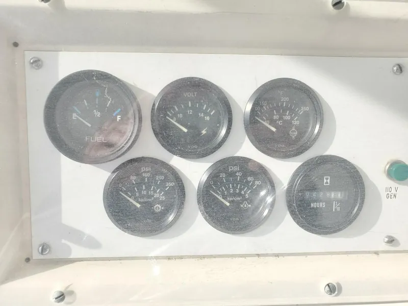 Slide: The Image of Dashboard gauges of a 1988 Post 46 Sportfish boat. - 21