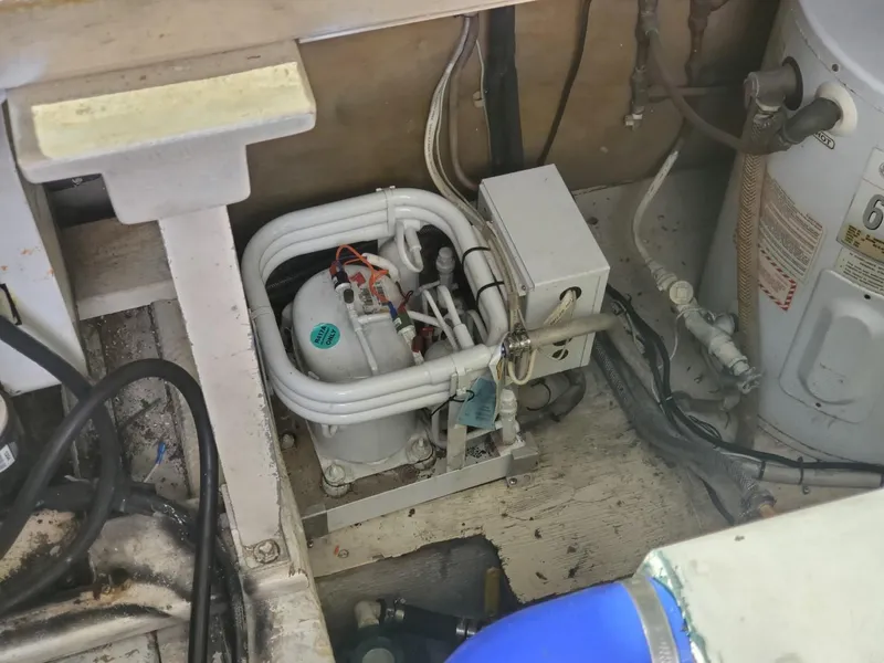 Slide: The Image of Engine room of 1988 Post 46 Sportfish boat, showing mechanical components. - 31