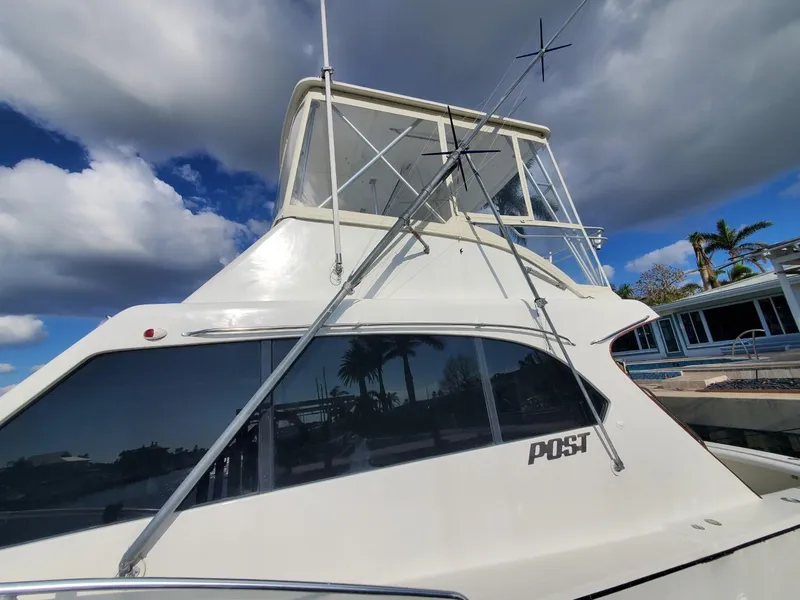 Slide: The Image of 1988 Post 46 Sportfish boat with flybridge under cloudy sky. - 7