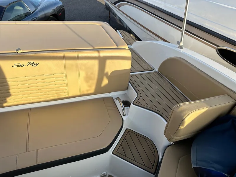 Slide: The Image of Interior of a 2021 Sea Ray SPX 190 boat with beige seating. - 11