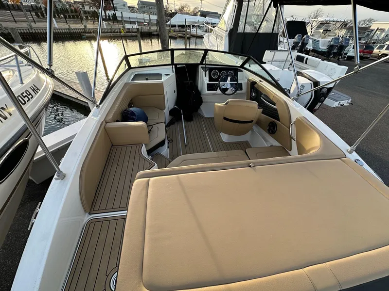 Slide: The Image of Interior view of a 2021 Sea Ray SPX 190 boat at the marina. - 12