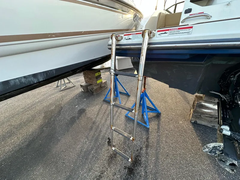 Slide: The Image of Sea Ray SPX 190 boat with ladder on stands, year 2021. - 14