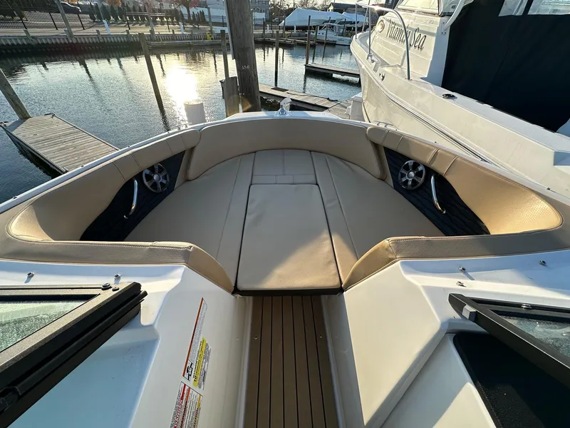 Slide: The Image of Interior view of 2021 Sea Ray SPX 190 boat at the marina. - 16