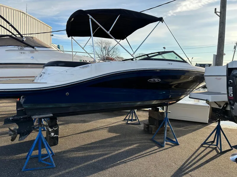 Slide: The Image of 2021 Sea Ray SPX 190 boat on stands outdoors. - 3