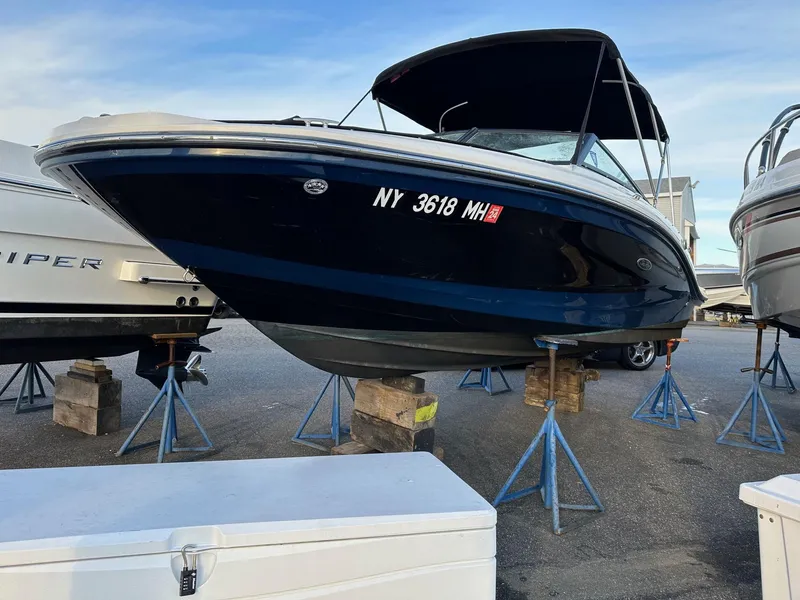 Slide: The Image of 2021 Sea Ray SPX 190 boat on stands outdoors. - 4