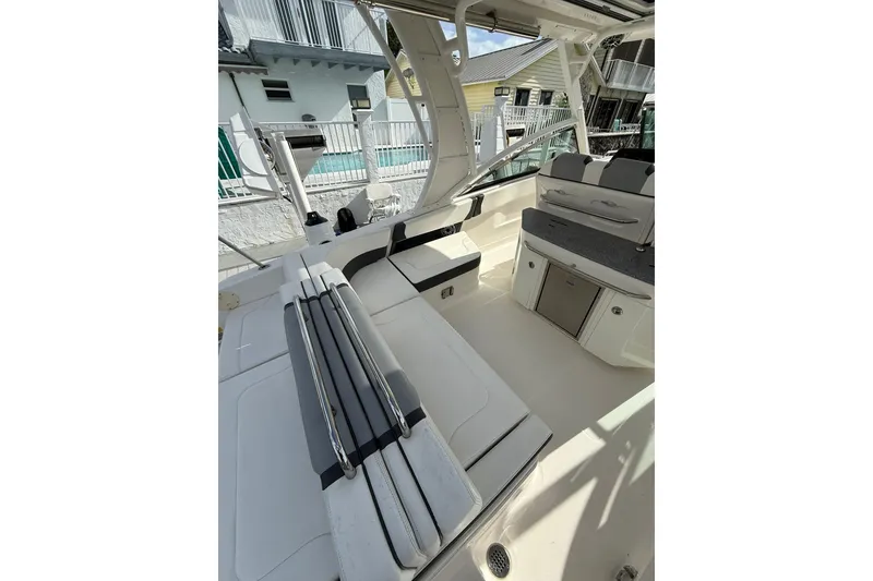 Slide: The Image of 2023 Chaparral 300 OSX boat interior with seating and storage compartments. - 15