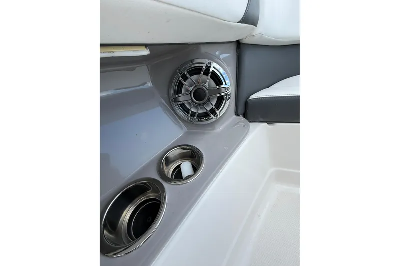 Slide: The Image of Interior of 2023 Chaparral 300 OSX boat with speaker and cup holders. - 49