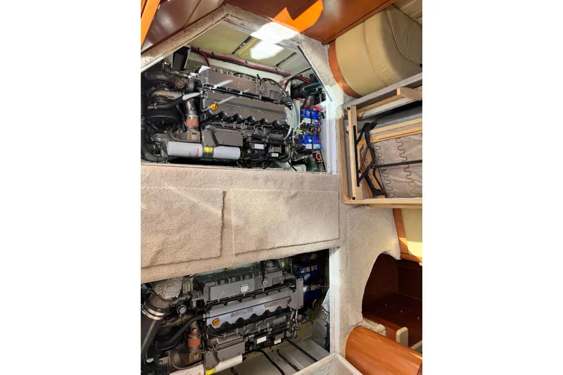 Slide: The Image of Engine room of a 2008 Silverton 42 Convertible yacht, showcasing dual engines. - 10