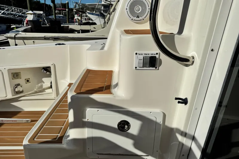 Slide: The Image of 2008 Silverton 42 Convertible yacht deck with controls and storage compartments. - 15
