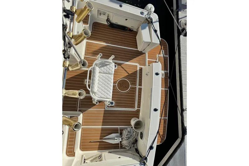 Slide: The Image of 2008 Silverton 42 Convertible boat deck with fishing chair and rod holders. - 16