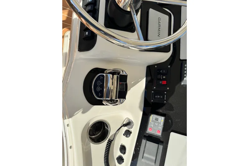 Slide: The Image of Helm controls of a 2008 Silverton 42 Convertible boat with Garmin navigation system. - 18