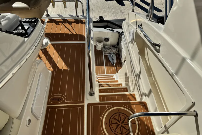 Slide: The Image of Interior view of 2008 Silverton 42 Convertible yacht with teak flooring and stainless steel railings. - 21