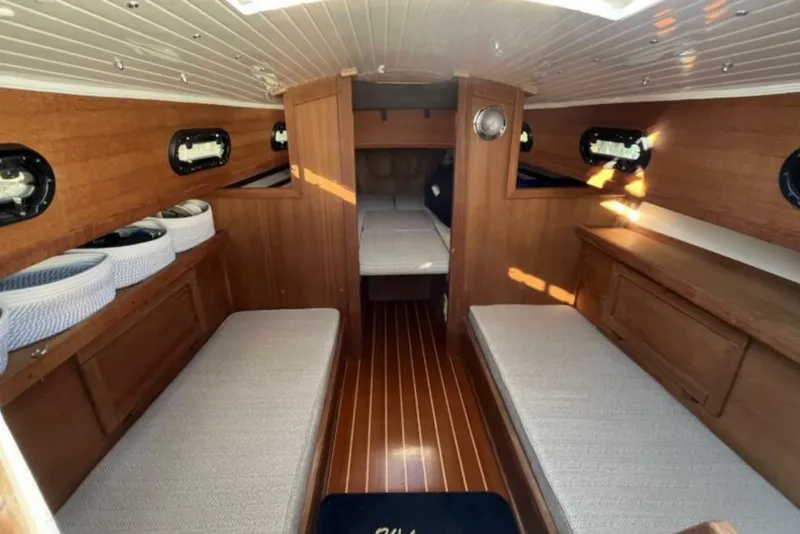 Slide: The Image of Interior of 2017 Com-Pac 23/IV sailboat with wooden finish and cozy seating. - 3