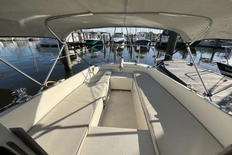 Slide: The Image of Spacious cockpit of 2017 Com-Pac 23/IV sailboat docked at marina. - 4
