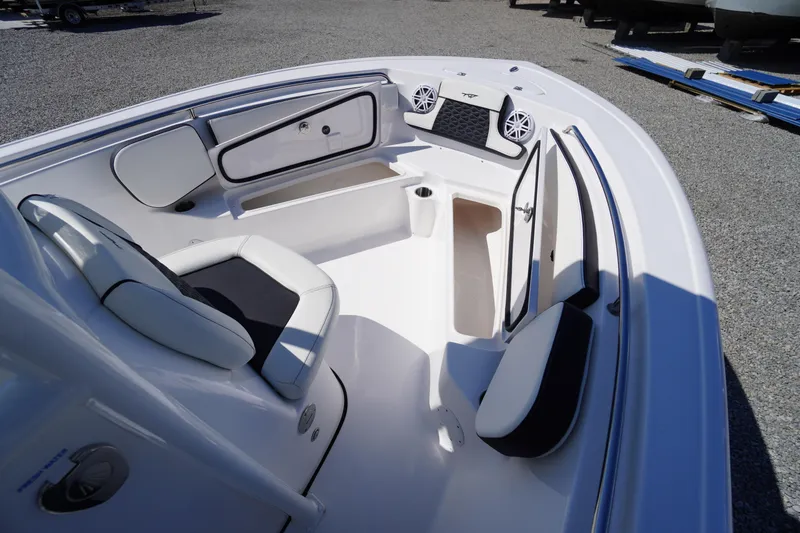 Slide: The Image of 2025 Tidewater 210 CC Adventure boat interior with seating and storage compartments. - 10