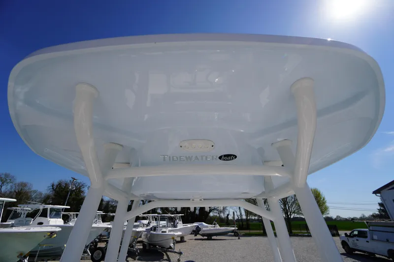 Slide: The Image of 2025 Tidewater 210 CC Adventure boat, viewed from below, showcasing its sleek design. - 15