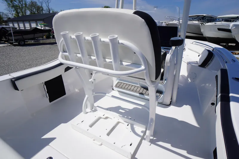 Slide: The Image of 2025 Tidewater 210 CC Adventure boat interior with rod holders and seating. - 22