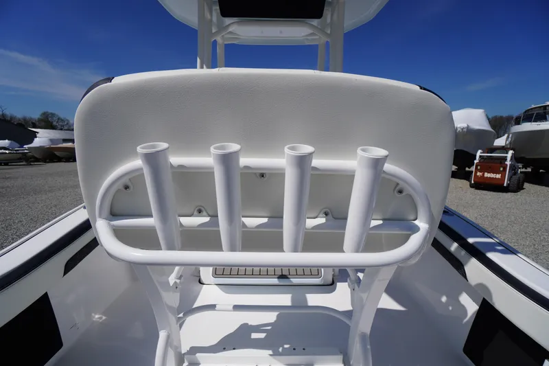 Slide: The Image of 2025 Tidewater 210 CC Adventure boat with rod holders, white seating, and sleek design. - 23