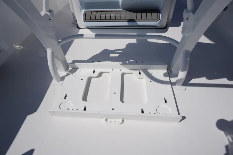 Slide: The Image of 2025 Tidewater 210 CC Adventure boat interior, showcasing a white deck and seating area. - 24