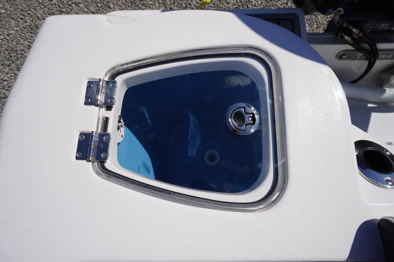Slide: The Image of Livewell hatch on 2025 Tidewater 210 CC Adventure boat, featuring stainless steel hinges. - 28
