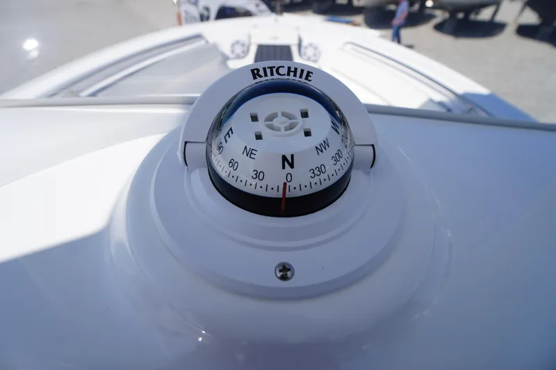 Slide: The Image of Compass on 2025 Tidewater 210 CC Adventure boat, showing north direction. - 29