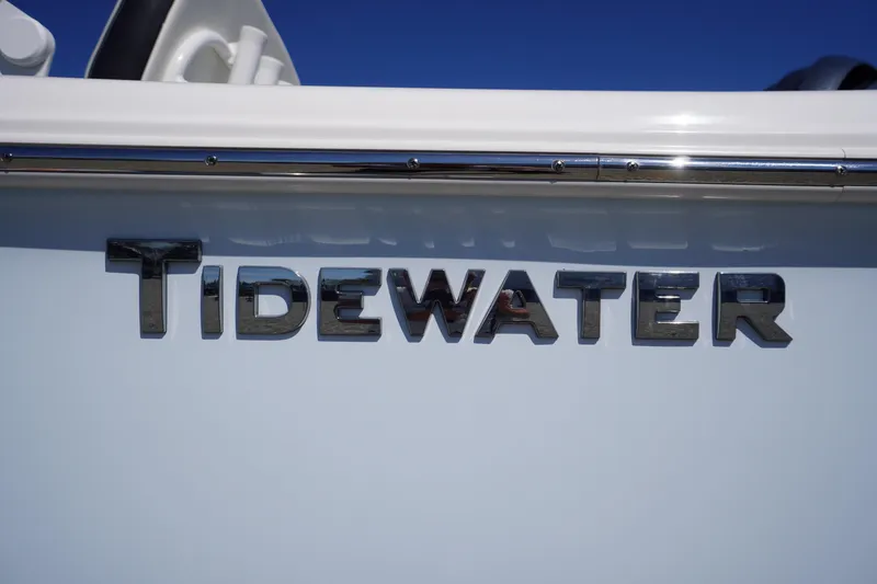 Slide: The Image of 2025 Tidewater 210 CC Adventure boat logo on sleek white surface. - 3