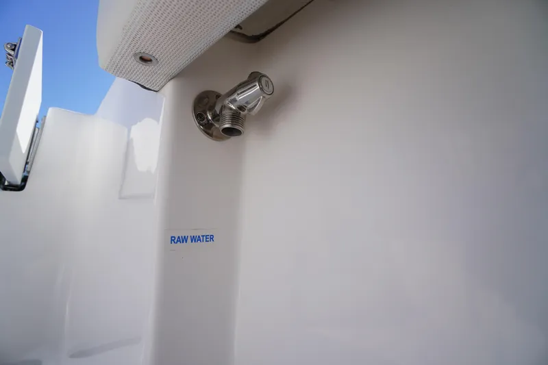 Slide: The Image of 2025 Tidewater 210 CC Adventure boat raw water outlet detail. - 31