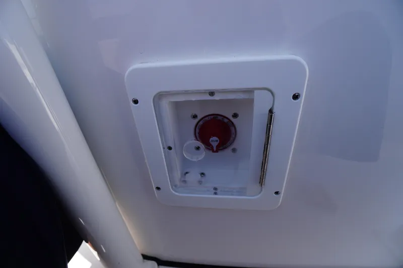 Slide: The Image of Control panel on 2025 Tidewater 210 CC Adventure boat, featuring a red dial. - 32