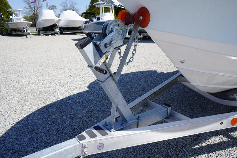 Slide: The Image of Trailer hitch of 2025 Tidewater 210 CC Adventure boat on gravel lot. - 37