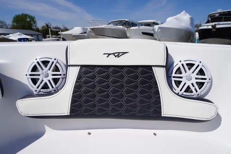 Slide: The Image of 2025 Tidewater 210 CC Adventure boat interior with JL Audio speakers and stylish upholstery. - 7