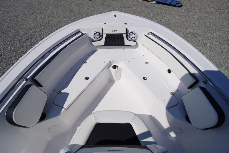 Slide: The Image of 2025 Tidewater 210 CC Adventure boat interior with seating and speakers. - 9