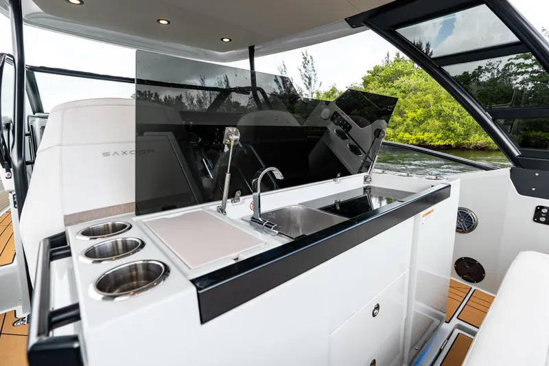 Slide: The Image of 2024 Saxdor 320 GTO boat interior with sleek kitchenette and modern design. - 18