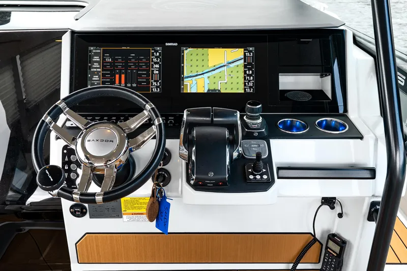 Slide: The Image of 2024 Saxdor 320 GTO helm with advanced navigation display and controls. - 21