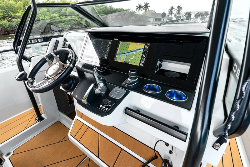 Slide: The Image of 2024 Saxdor 320 GTO helm with modern navigation system and sleek design. - 22