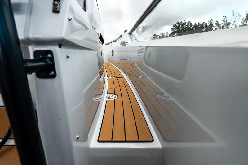 Slide: The Image of 2024 Saxdor 320 GTO boat deck with sleek design and wood finish. - 23