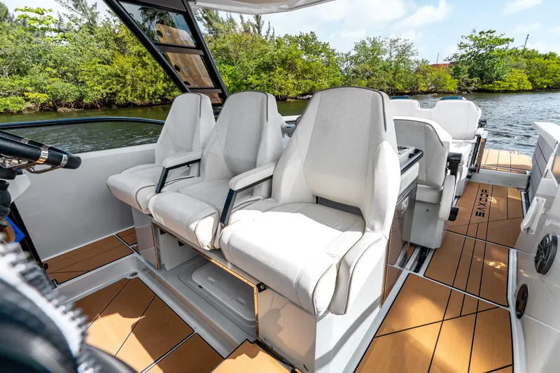 Slide: The Image of 2024 Saxdor 320 GTO boat interior with luxurious white seating and sleek design. - 28