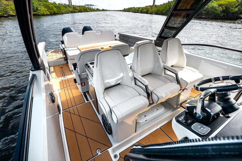 Slide: The Image of 2024 Saxdor 320 GTO boat interior with modern seating and sleek design on the water. - 29