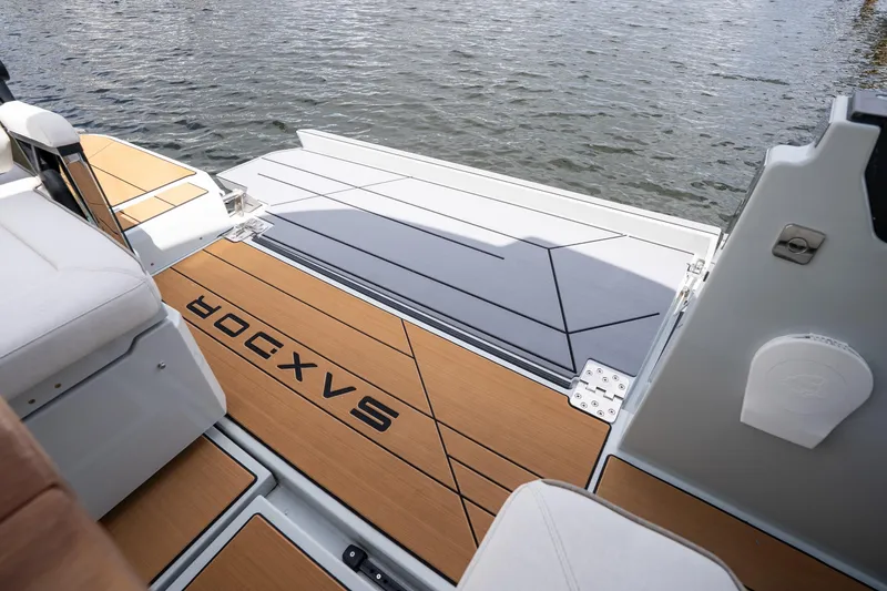 Slide: The Image of 2024 Saxdor 320 GTO boat deck with stylish seating and water view. - 43