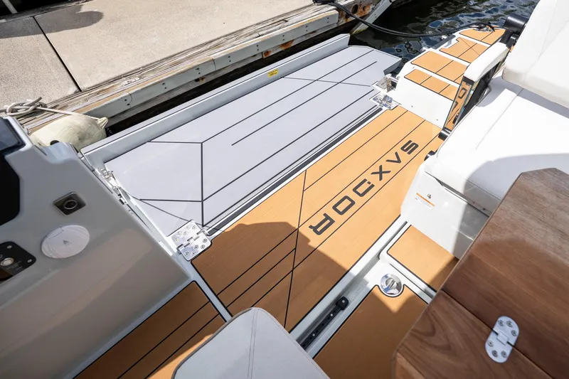 Slide: The Image of 2024 Saxdor 320 GTO boat deck with teak flooring and modern design elements. - 44