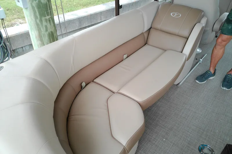 Slide: The Image of 2016 Veranda Relax V2275RC boat interior with beige seating and carpeted floor. - 16