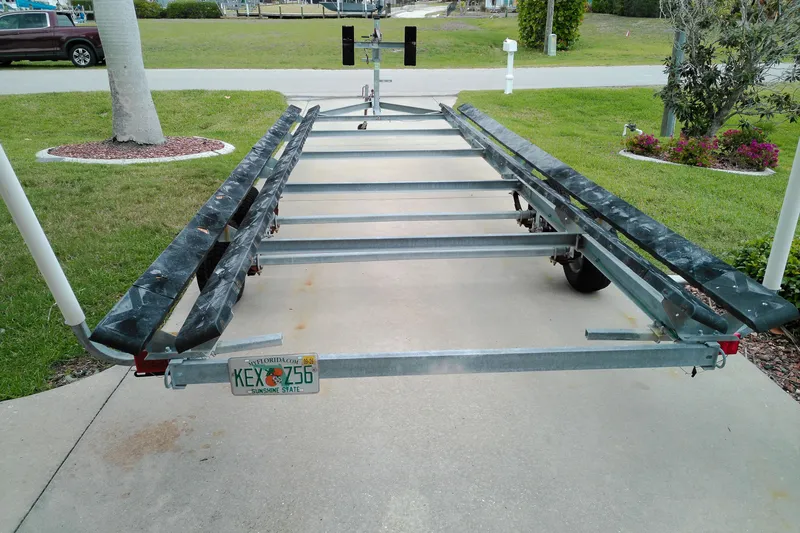 Slide: The Image of 2016 Veranda Relax V2275RC boat trailer parked on driveway with Florida license plate. - 22