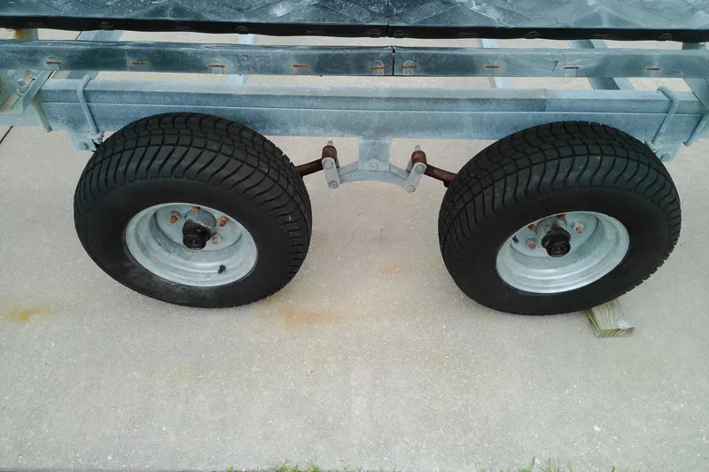 Slide: The Image of Trailer wheels and axle of a 2016 Veranda Relax V2275RC on concrete surface. - 23