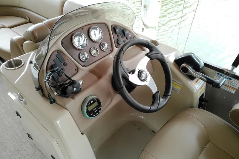 Slide: The Image of Steering console of 2016 Veranda Relax V2275RC pontoon boat with gauges and controls. - 6