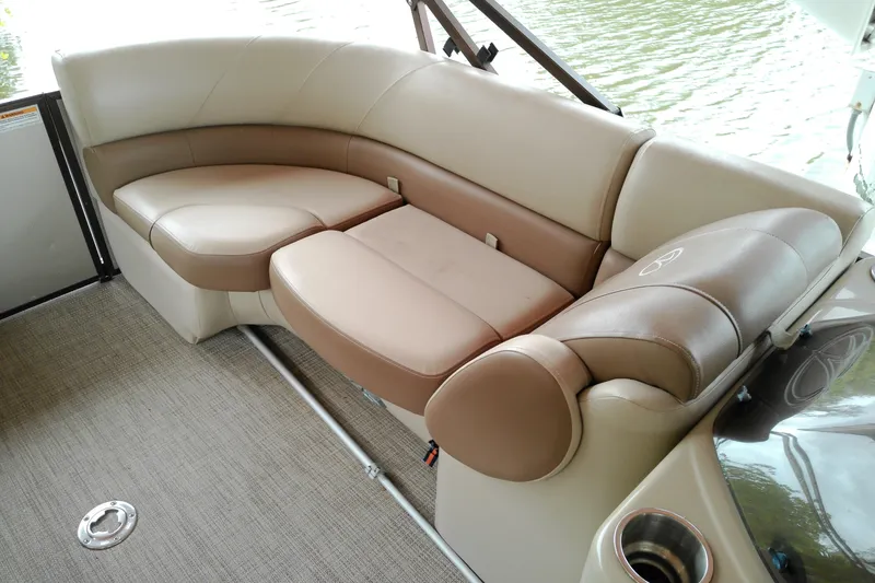 Slide: The Image of 2016 Veranda Relax V2275RC boat interior with beige and brown seating. - 8