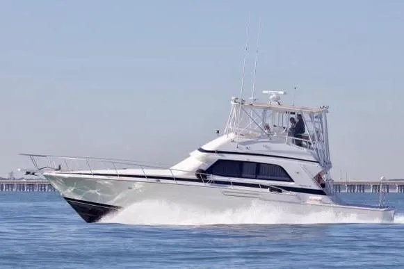 The Image of 1989 Bertram 50 Convertible yacht cruising on open water. - 0