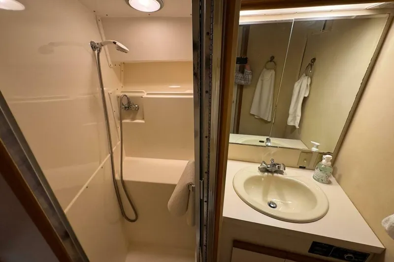 Slide: The Image of Bathroom interior of 1989 Bertram 50 Convertible yacht with shower and sink. - 10