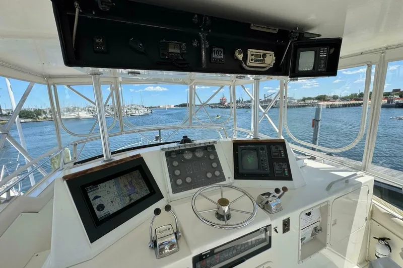 Slide: The Image of Cockpit view of a 1989 Bertram 50 Convertible yacht with navigation equipment. - 20