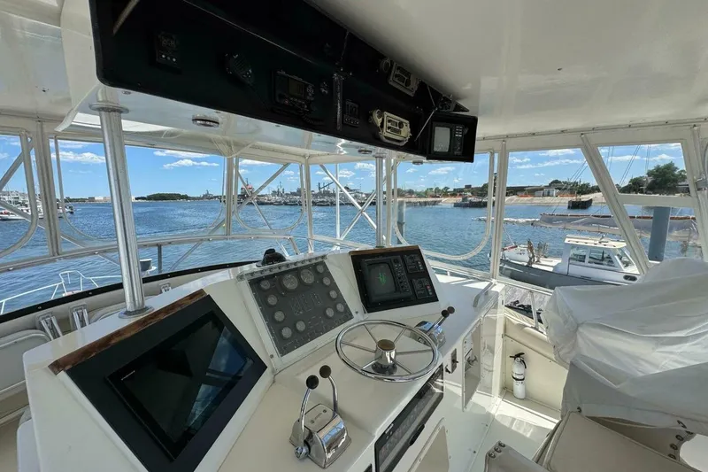 Slide: The Image of Interior view of 1989 Bertram 50 Convertible yacht cockpit with navigation equipment. - 21