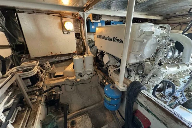 Slide: The Image of Engine room of a 1989 Bertram 50 Convertible with MAN Marine Diesel engine. - 4